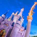 Cinderella Castle at Walt Disney World Magic Kingdom at blue hour, seen through an archway