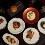 Disney signature dining experience with multiple plated courses and wine