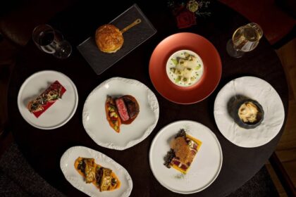 Disney signature dining experience with multiple plated courses and wine