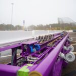 Purple roller coaster track pieces arriving at Six Flags Great Adventure for the new 2027 record-breaking coaster