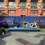 D23 2026 media event stage with Sorcerer Mickey banners and D23 logo