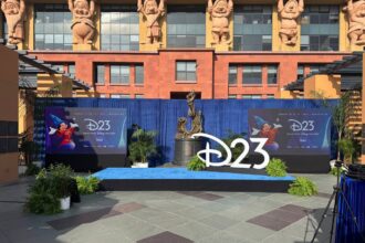 D23 2026 media event stage with Sorcerer Mickey banners and D23 logo