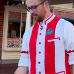 Disney Cast Member holding a baseball on Main Street U.S.A. at Walt Disney World