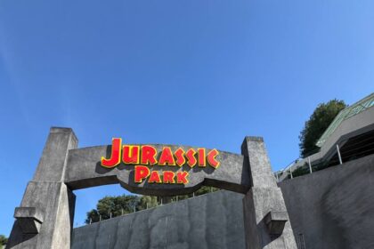 John Hammond face character at the Jurassic Park archway at Universal Studios Hollywood Journey Through the Eras