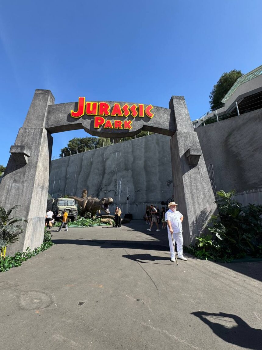 John Hammond face character at the Jurassic Park archway at Universal Studios Hollywood Journey Through the Eras