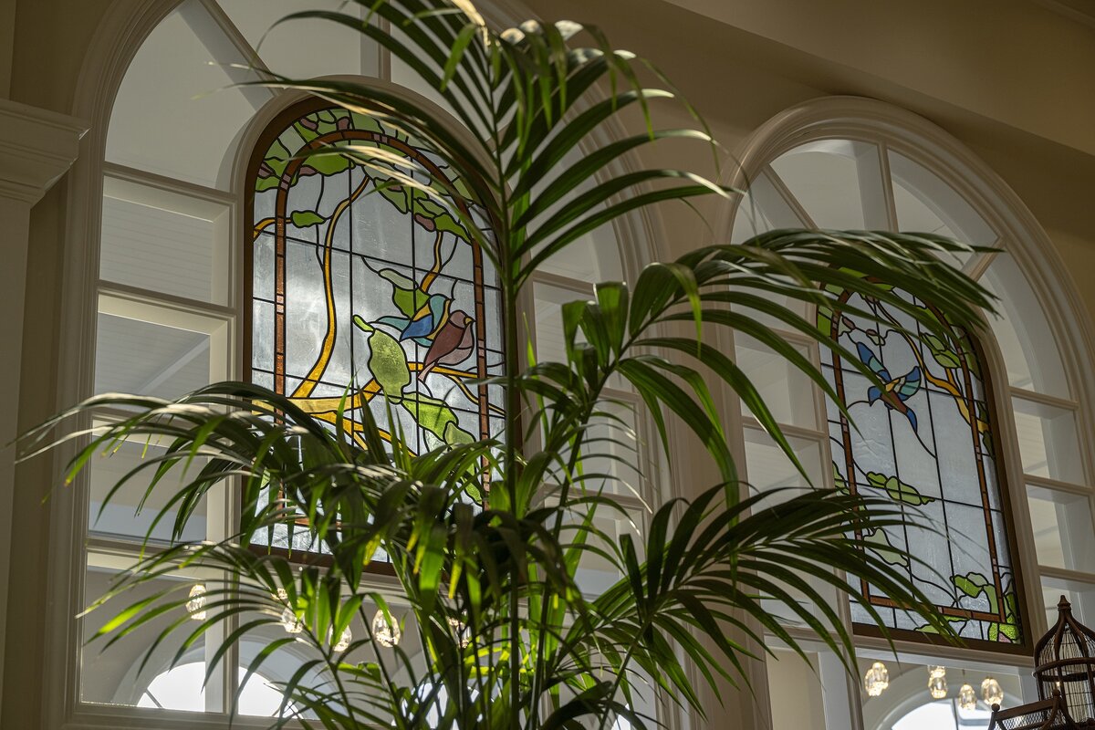 Stained glass windows featuring Florida birds at the Garden View Tea Lounge