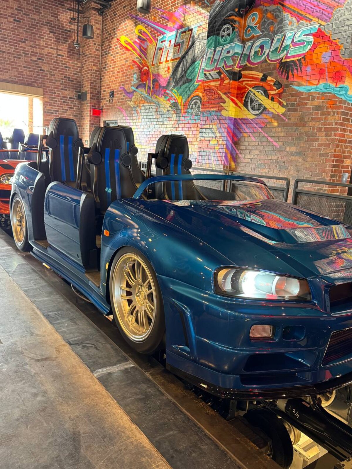 Brian's Nissan Skyline GT-R R34 ride vehicle close-up inside Fast & Furious: Hollywood Drift
