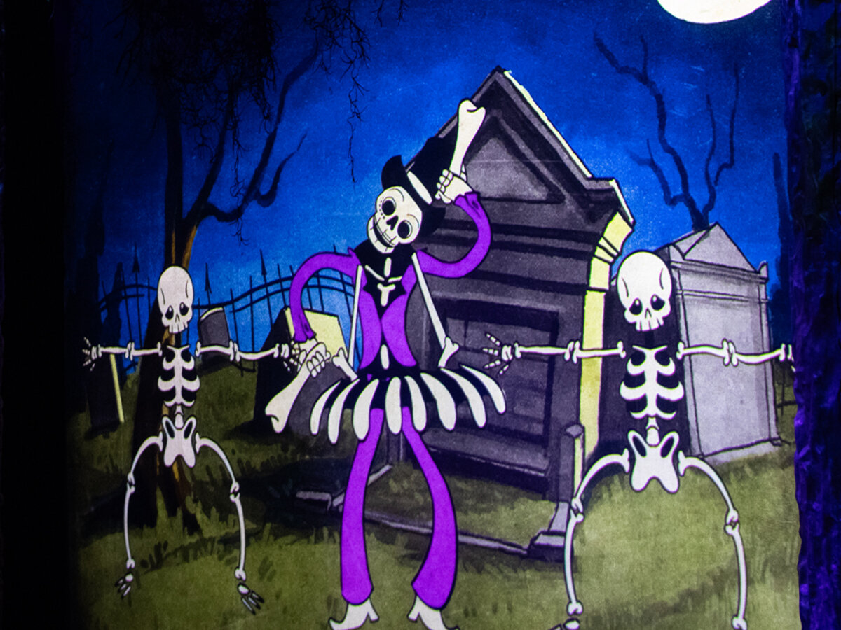 Animated Baron TonTon dancing in cemetery scene at Universal Mardi Gras 2026 Tribute Store