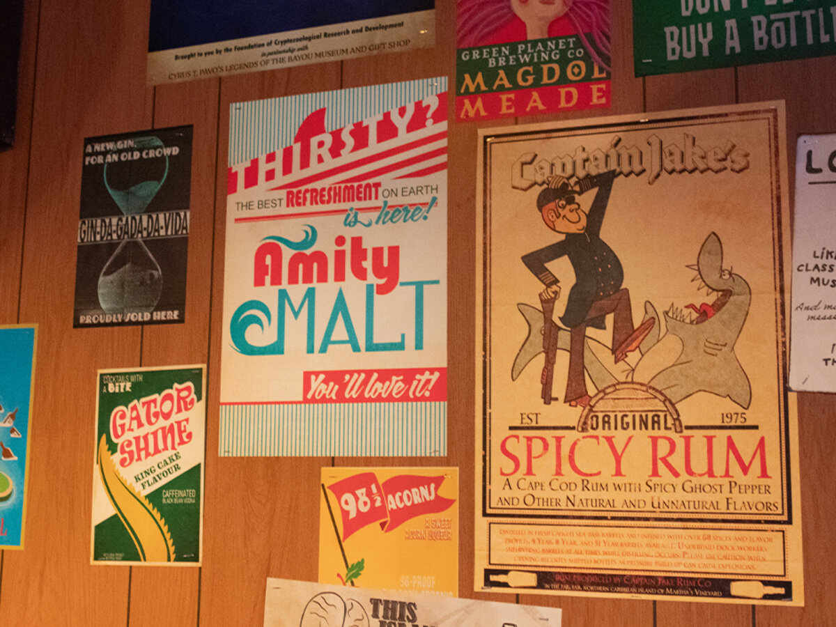 Vintage-style posters and Easter eggs inside Universal Mardi Gras 2026 Tribute Store