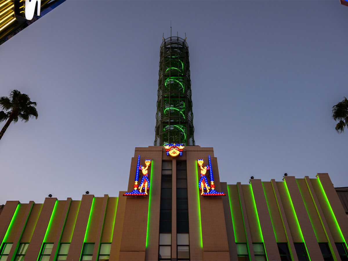 Historic neon signs illuminated at night at Universal CityWalk Hollywood