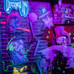 Neon Baron TonTon artwork at Universal Mardi Gras 2026 Tribute Store