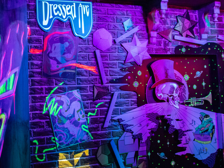 Neon Baron TonTon artwork at Universal Mardi Gras 2026 Tribute Store