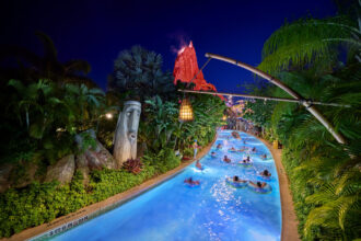 Kopiko Wai Winding River glowing blue at night during Volcano Bay Nights 2026