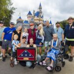 Charles Cram honored at Disneyland Flag Retreat ceremony with family and Disneyland ambassadors