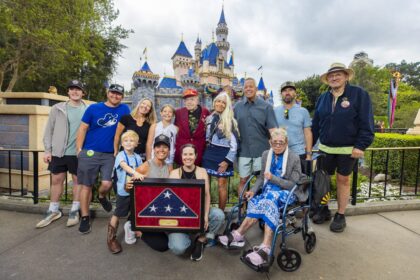 Charles Cram honored at Disneyland Flag Retreat ceremony with family and Disneyland ambassadors