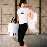 Model wearing a Disney and RE/DONE Devil Wears Prada inspired graphic tee from the new capsule collection