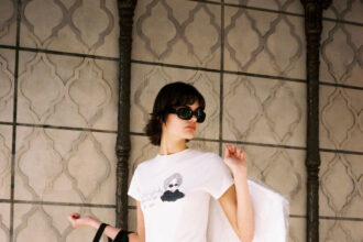 Model wearing a Disney and RE/DONE Devil Wears Prada inspired graphic tee from the new capsule collection