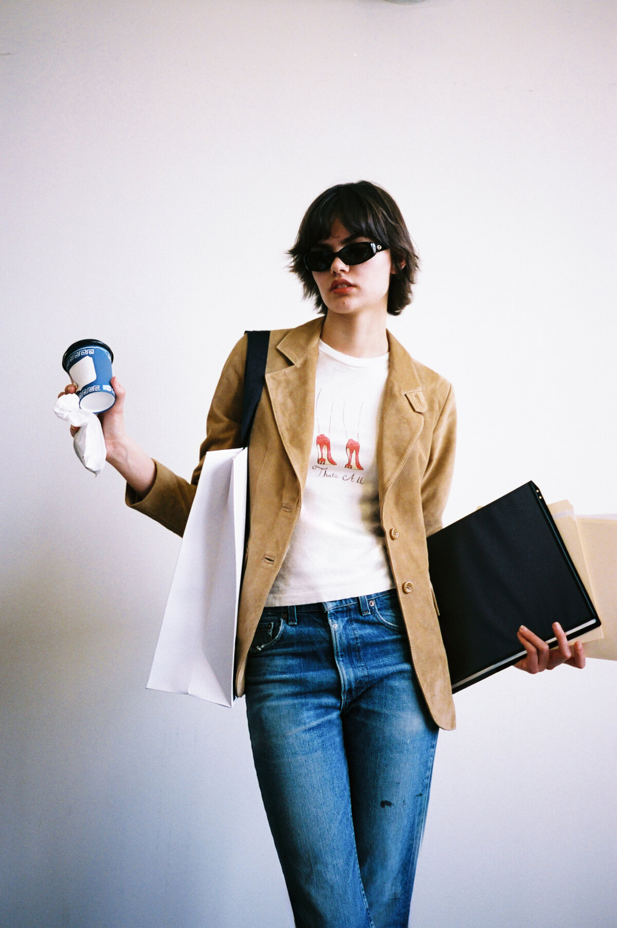 Model wearing the That's All graphic tee from the Disney and RE/DONE Devil Wears Prada 2 capsule collection