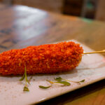 Street elote at Antojitos for the Cinco de Mayo menu at Universal CityWalk