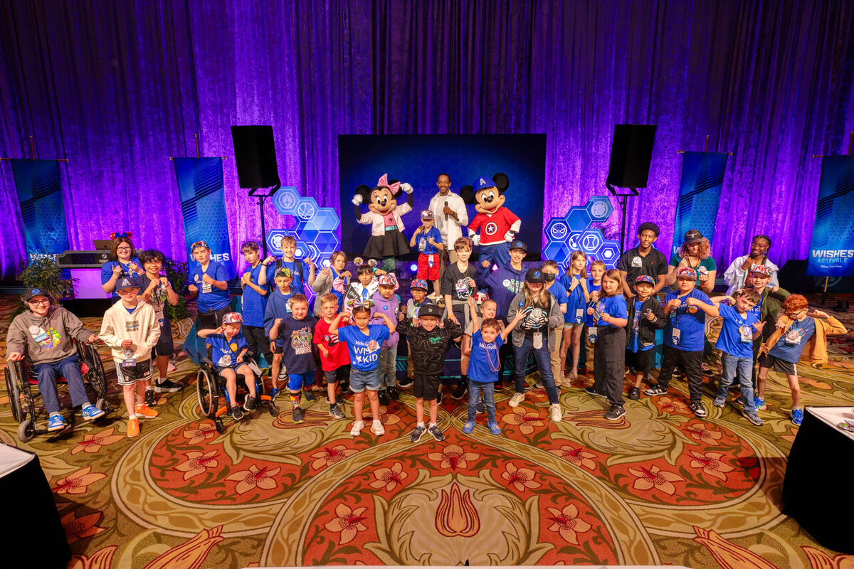 Anthony Mackie, Mickey Mouse and Minnie Mouse appear with Make-A-Wish kids during Wishes Assemble.