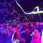 Guests covered in streamers during Blue Man Group Orlando at ICON Park.