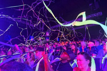 Guests covered in streamers during Blue Man Group Orlando at ICON Park.
