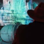 Grogu projection lighting at Star Wars: Galaxy’s Edge in Disneyland park for The Curious Child.
