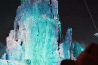 Grogu projection lighting at Star Wars: Galaxy’s Edge in Disneyland park for The Curious Child.
