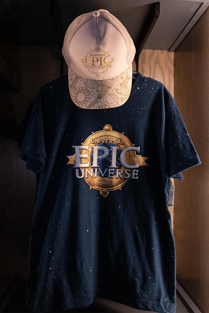 Universal Epic Universe T-shirt merchandise shown in Universal Orlando Resort's official merchandise guide