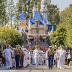 Service members march on Main Street, U.S.A. during Disneyland LA Fleet Week