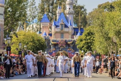 Service members march on Main Street, U.S.A. during Disneyland LA Fleet Week