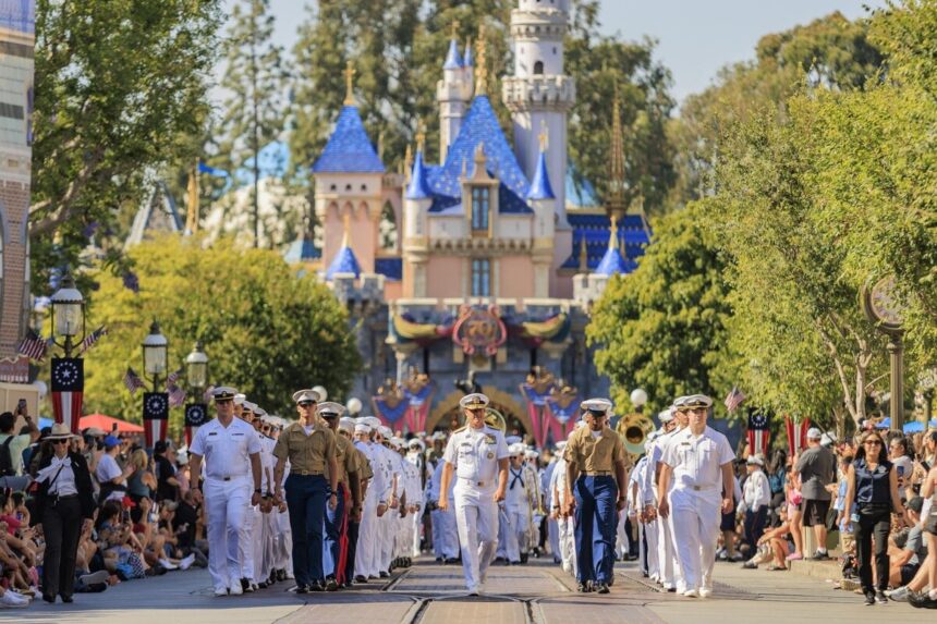 Service members march on Main Street, U.S.A. during Disneyland LA Fleet Week