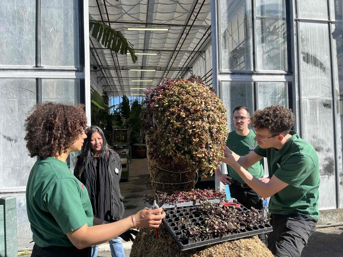 Disneyland Paris horticulture team trimming a topiary base