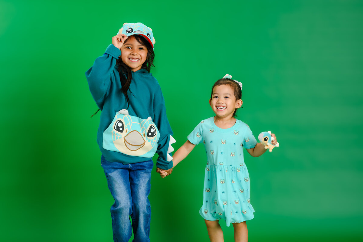 Kids wearing dinosaur apparel from Jurassic World Outfitters