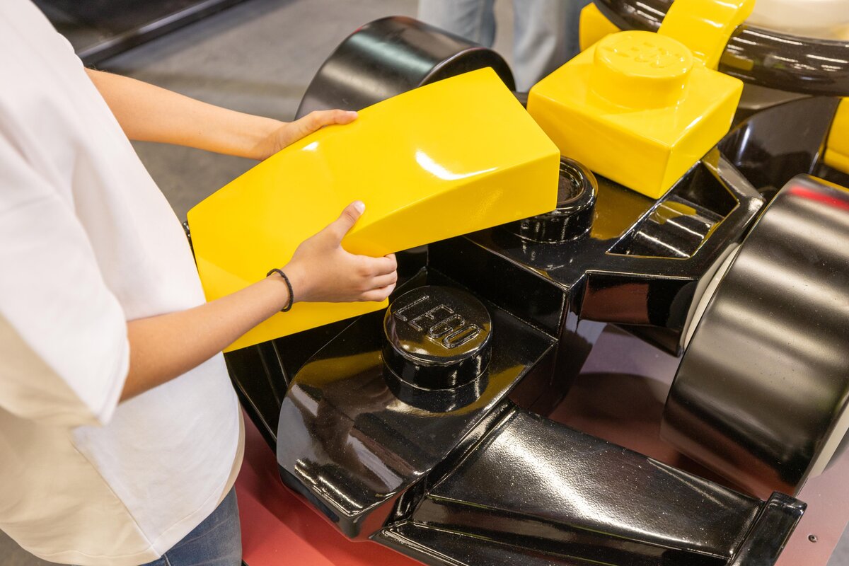 A guest builds a LEGO F1 car at LEGO Festival 2026 at LEGOLAND Florida Resort