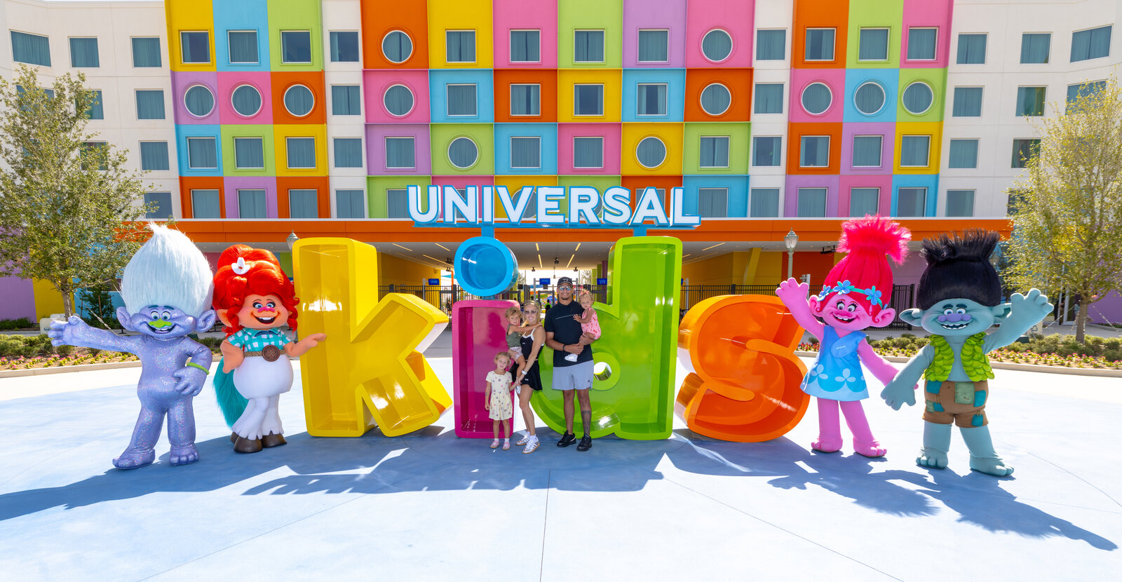 Patrick Mahomes and family with TrollsFest characters at Universal Kids Resort in Frisco Texas