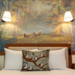 Guest room at the reimagined Treehouse Villas at Disney's Saratoga Springs Resort with a Fox and the Hound forest mural