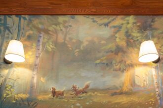 Guest room at the reimagined Treehouse Villas at Disney's Saratoga Springs Resort with a Fox and the Hound forest mural