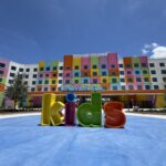 Colorful Universal Kids Resort hotel facade with giant kids letter sculpture in Frisco Texas