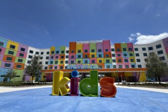Colorful Universal Kids Resort hotel facade with giant kids letter sculpture in Frisco Texas