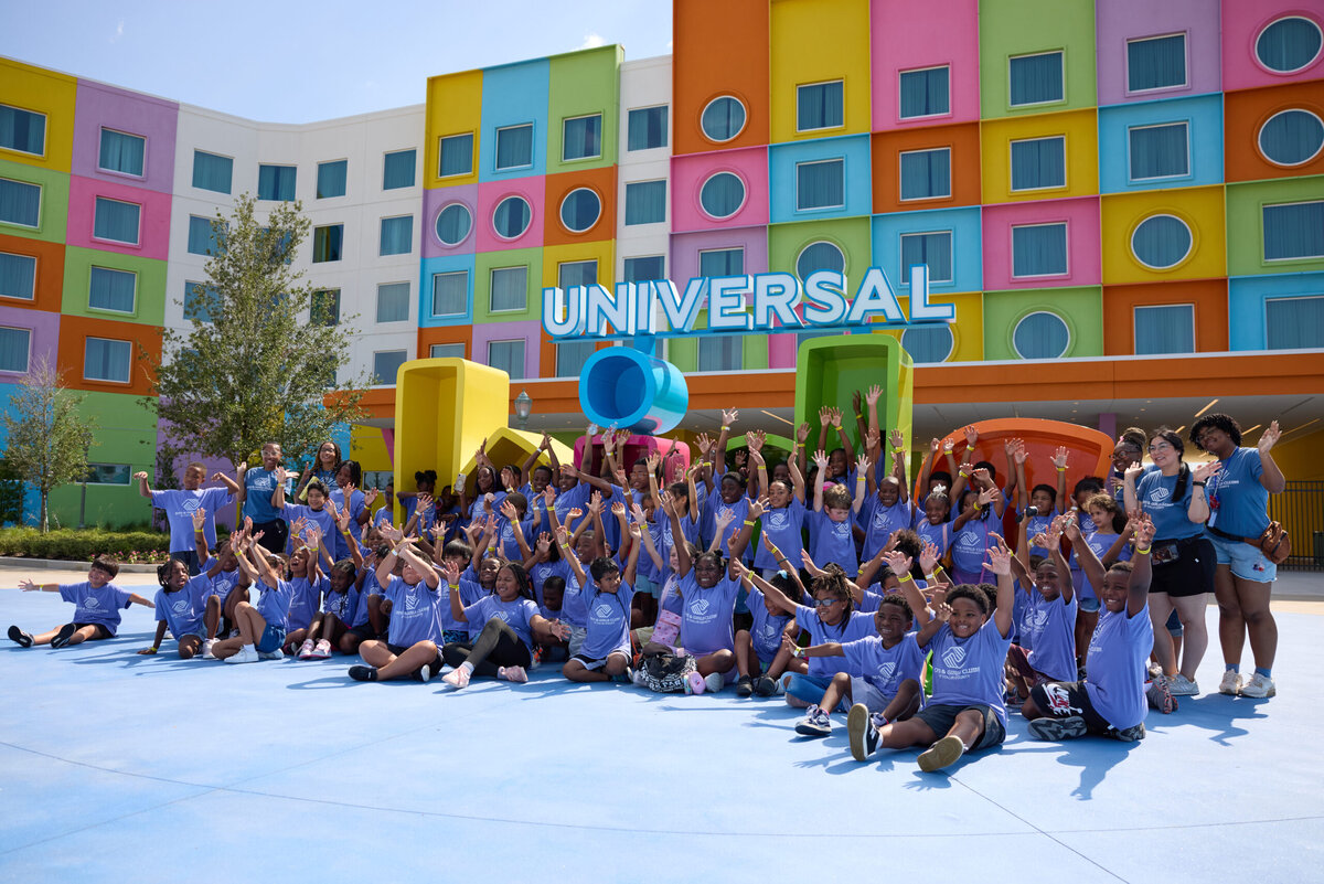 Nearly 400 Boys and Girls Clubs children gathered in front of the colorful Universal Kids Resort entrance