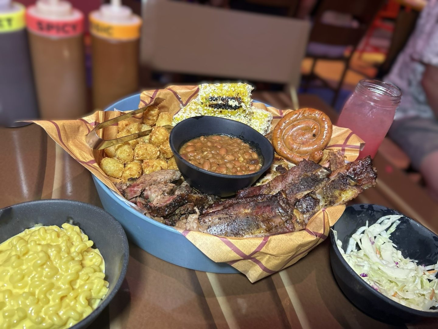 Roundup Rodeo BBQ all-you-care-to-enjoy skillet of house-smoked ribs, sausage, and brisket with sides at Disney's Hollywood Studios