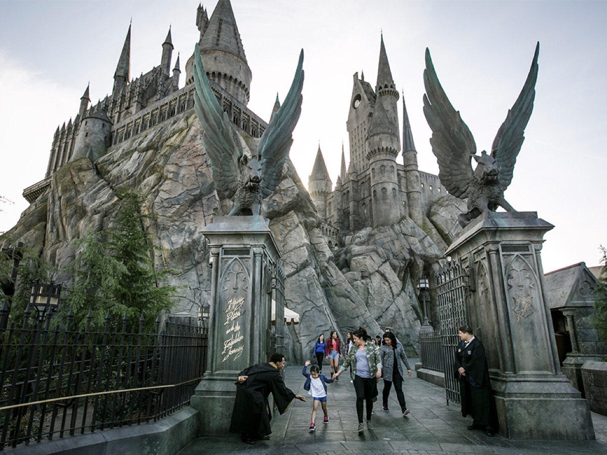 Guests walking out of the Hogwarts castle entrance to Harry Potter and the Forbidden Journey
