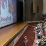 Josh D'Amaro and Mickey Mouse surprise Camp Pendleton military families with Disneyland Resort tickets during a Toy Story 5 screening.