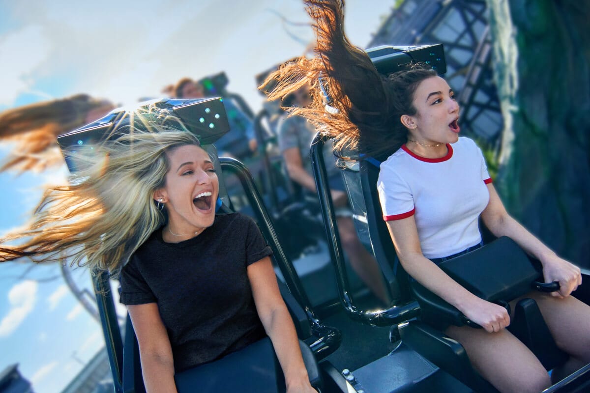Two riders reacting on a roller coaster at Universal Orlando Resort