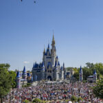 U.S. Air Force aircraft fly over Cinderella Castle at Magic Kingdom as crowds watch during Walt Disney World's July 4 2026 flyover