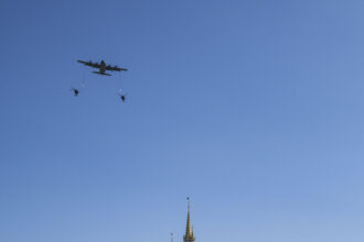 U.S. Air Force aircraft fly over Cinderella Castle at Magic Kingdom as crowds watch during Walt Disney World's July 4 2026 flyover