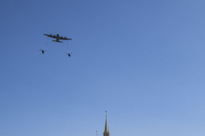 U.S. Air Force aircraft fly over Cinderella Castle at Magic Kingdom as crowds watch during Walt Disney World's July 4 2026 flyover