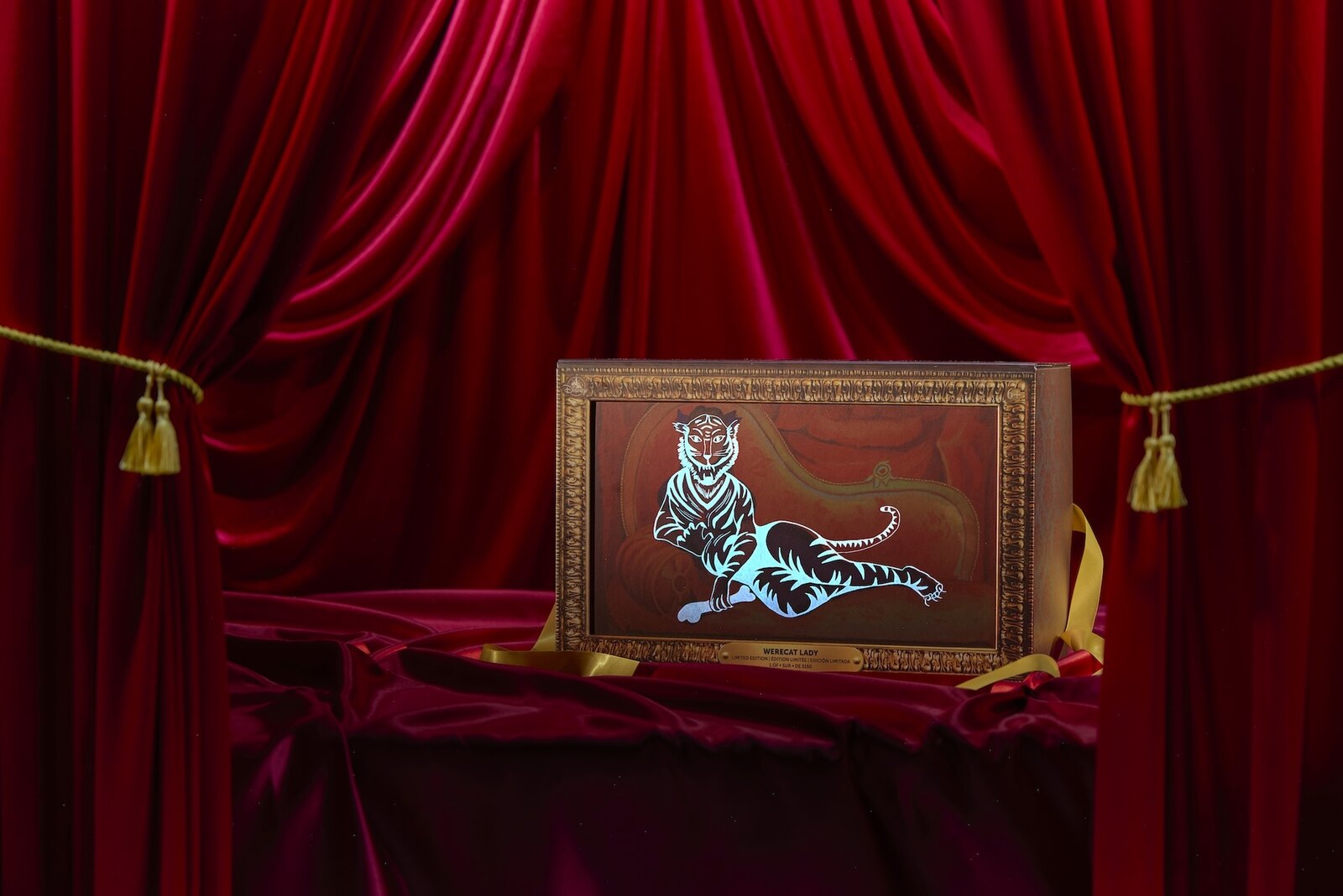 Werecat Lady doll portrait box glowing under UV light to reveal a white tigress