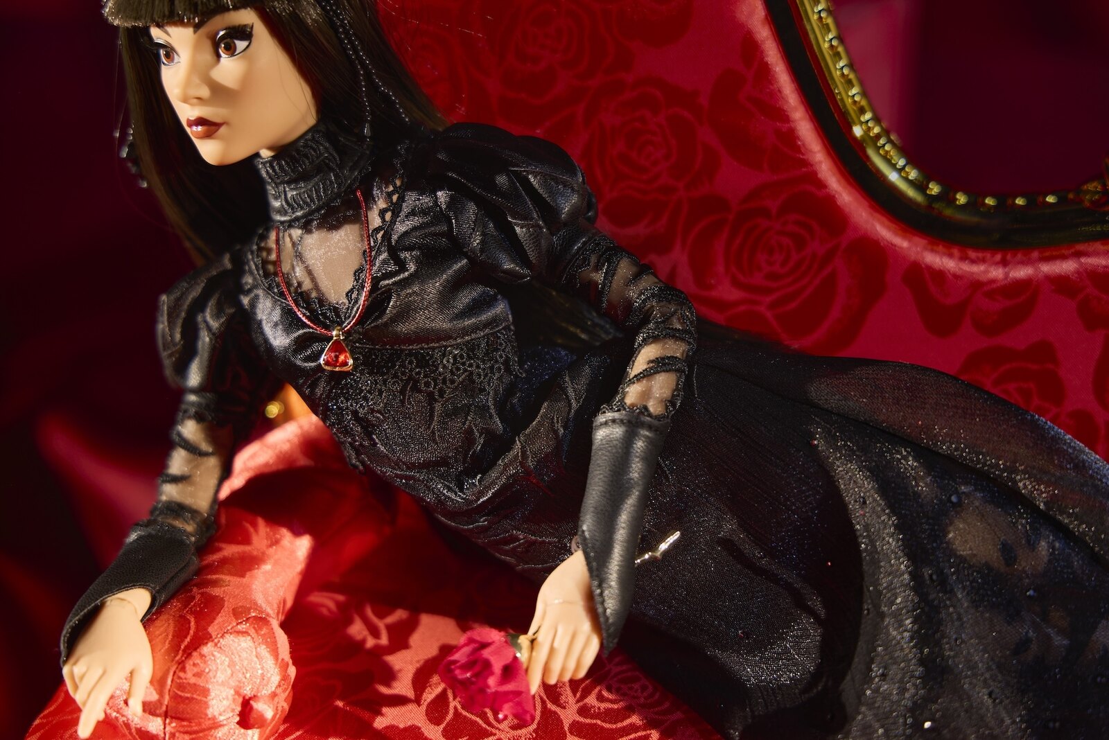 Werecat Lady limited-edition Disney doll in a black lace gown with a red teardrop necklace